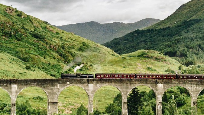Glenfinnan Viaduct, Scotland - image by Bjorn Snelders on Unsplash https://unsplash.com/photos/train-passing-by-bridge-over-mountains-zNNPSqKRR2c