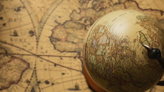 Vintage globe and map - image by Charles Chen on Unsplash https://unsplash.com/photos/a-compass-on-a-map-I6qzmDy1Ou0