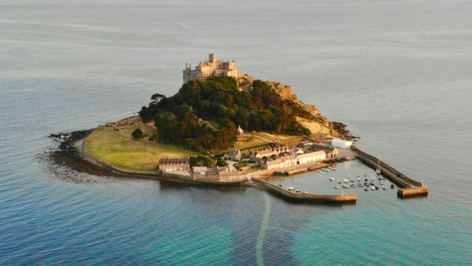 St Michael's Mount, Cornwall, England - image by Benjamin Elliott on Unsplash https://unsplash.com/photos/boat-dock-near-island-during-daytime-sg7zgMb3OQY