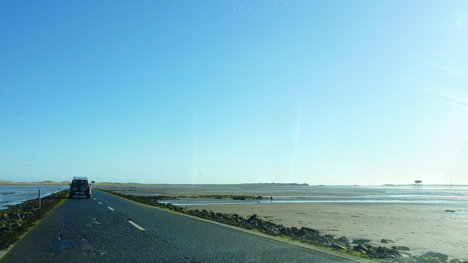Lindisfarne Causeway - image by Richard Cooke https://commons.wikimedia.org/wiki/File:Lindisfarne_Causeway_-_geograph.org.uk_-_3488751.jpg