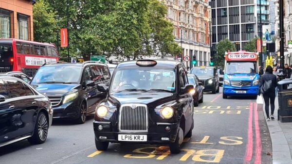Black taxi cab near Harrod's